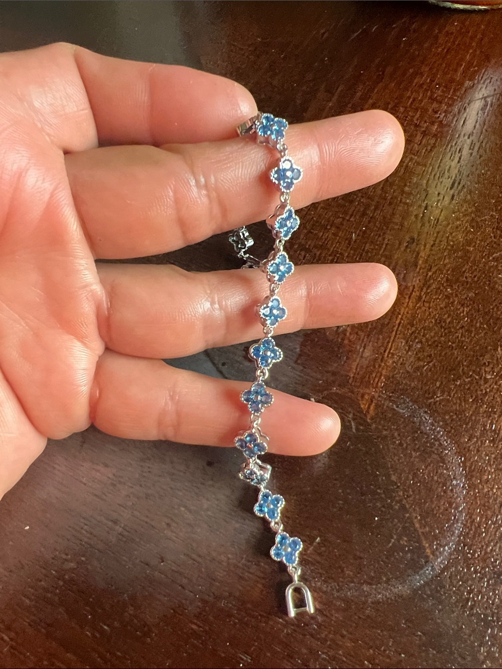 Silver Bracelet with Blue Flower Charm Accents